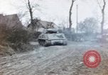 Image of U.S. armor and troops pass through town near end of World War II Germany, 1945, second 47 stock footage video 65675076290