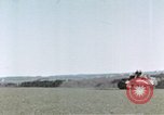 Image of U.S. armor and troops pass through town near end of World War II Germany, 1945, second 50 stock footage video 65675076290
