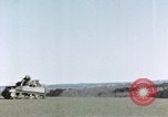 Image of U.S. armor and troops pass through town near end of World War II Germany, 1945, second 56 stock footage video 65675076290