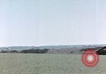 Image of U.S. armor and troops pass through town near end of World War II Germany, 1945, second 58 stock footage video 65675076290