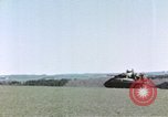 Image of U.S. armor and troops pass through town near end of World War II Germany, 1945, second 60 stock footage video 65675076290