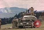 Image of U.S tank shells a German village at end of World War II Germany, 1945, second 30 stock footage video 65675076623