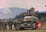 Image of U.S tank shells a German village at end of World War II Germany, 1945, second 49 stock footage video 65675076623