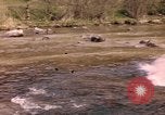 Image of U.S. troops ride on tanks crossing a stream Germany, 1945, second 1 stock footage video 65675076625