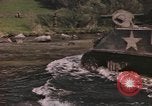 Image of U.S. troops ride on tanks crossing a stream Germany, 1945, second 3 stock footage video 65675076625