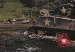 Image of U.S. troops ride on tanks crossing a stream Germany, 1945, second 4 stock footage video 65675076625