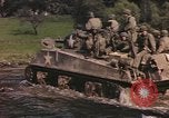 Image of U.S. troops ride on tanks crossing a stream Germany, 1945, second 7 stock footage video 65675076625