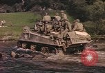 Image of U.S. troops ride on tanks crossing a stream Germany, 1945, second 9 stock footage video 65675076625