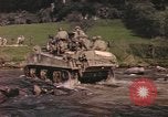 Image of U.S. troops ride on tanks crossing a stream Germany, 1945, second 11 stock footage video 65675076625