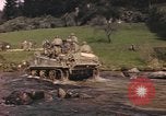 Image of U.S. troops ride on tanks crossing a stream Germany, 1945, second 14 stock footage video 65675076625