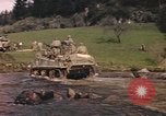 Image of U.S. troops ride on tanks crossing a stream Germany, 1945, second 15 stock footage video 65675076625