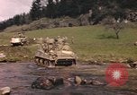 Image of U.S. troops ride on tanks crossing a stream Germany, 1945, second 18 stock footage video 65675076625