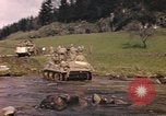 Image of U.S. troops ride on tanks crossing a stream Germany, 1945, second 19 stock footage video 65675076625