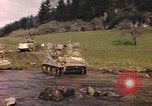 Image of U.S. troops ride on tanks crossing a stream Germany, 1945, second 20 stock footage video 65675076625