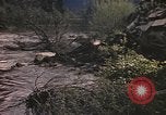 Image of U.S. troops ride on tanks crossing a stream Germany, 1945, second 25 stock footage video 65675076625