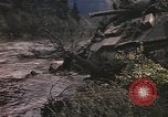 Image of U.S. troops ride on tanks crossing a stream Germany, 1945, second 30 stock footage video 65675076625