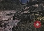 Image of U.S. troops ride on tanks crossing a stream Germany, 1945, second 31 stock footage video 65675076625