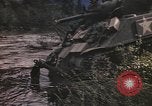 Image of U.S. troops ride on tanks crossing a stream Germany, 1945, second 32 stock footage video 65675076625