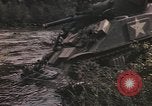 Image of U.S. troops ride on tanks crossing a stream Germany, 1945, second 33 stock footage video 65675076625