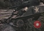 Image of U.S. troops ride on tanks crossing a stream Germany, 1945, second 34 stock footage video 65675076625