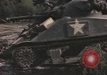 Image of U.S. troops ride on tanks crossing a stream Germany, 1945, second 36 stock footage video 65675076625