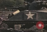 Image of U.S. troops ride on tanks crossing a stream Germany, 1945, second 39 stock footage video 65675076625