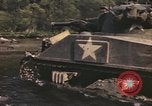 Image of U.S. troops ride on tanks crossing a stream Germany, 1945, second 42 stock footage video 65675076625