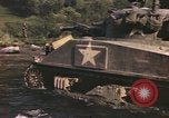 Image of U.S. troops ride on tanks crossing a stream Germany, 1945, second 43 stock footage video 65675076625