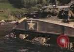 Image of U.S. troops ride on tanks crossing a stream Germany, 1945, second 44 stock footage video 65675076625