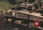 Image of U.S. troops ride on tanks crossing a stream Germany, 1945, second 45 stock footage video 65675076625