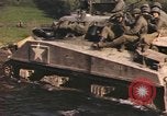 Image of U.S. troops ride on tanks crossing a stream Germany, 1945, second 46 stock footage video 65675076625