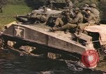 Image of U.S. troops ride on tanks crossing a stream Germany, 1945, second 47 stock footage video 65675076625