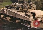 Image of U.S. troops ride on tanks crossing a stream Germany, 1945, second 48 stock footage video 65675076625