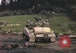 Image of U.S. troops ride on tanks crossing a stream Germany, 1945, second 54 stock footage video 65675076625