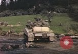 Image of U.S. troops ride on tanks crossing a stream Germany, 1945, second 55 stock footage video 65675076625
