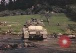 Image of U.S. troops ride on tanks crossing a stream Germany, 1945, second 57 stock footage video 65675076625