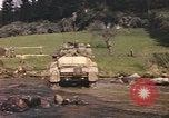 Image of U.S. troops ride on tanks crossing a stream Germany, 1945, second 59 stock footage video 65675076625