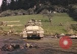 Image of U.S. troops ride on tanks crossing a stream Germany, 1945, second 60 stock footage video 65675076625