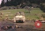 Image of U.S. troops ride on tanks crossing a stream Germany, 1945, second 61 stock footage video 65675076625