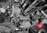 Image of Army artillery being repaired and reconditioned in a factory United States USA, 1945, second 17 stock footage video 65675076676
