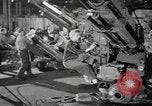 Image of Army artillery being repaired and reconditioned in a factory United States USA, 1945, second 20 stock footage video 65675076676