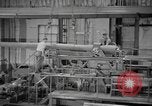 Image of Army artillery being repaired and reconditioned in a factory United States USA, 1945, second 36 stock footage video 65675076676