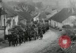 Image of AEF artillerymen moving through a French Village France, 1918, second 13 stock footage video 65675076714