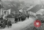 Image of AEF artillerymen moving through a French Village France, 1918, second 20 stock footage video 65675076714