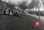 Image of AEF artillerymen moving through a French Village France, 1918, second 54 stock footage video 65675076714