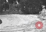 Image of Boy dressed in grass skirt performs hula dance Fort Lauderdale Florida USA, 1920, second 5 stock footage video 65675076871