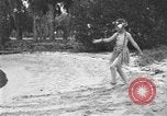 Image of Boy dressed in grass skirt performs hula dance Fort Lauderdale Florida USA, 1920, second 6 stock footage video 65675076871