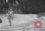 Image of Boy dressed in grass skirt performs hula dance Fort Lauderdale Florida USA, 1920, second 11 stock footage video 65675076871
