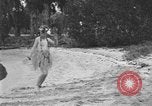 Image of Boy dressed in grass skirt performs hula dance Fort Lauderdale Florida USA, 1920, second 12 stock footage video 65675076871
