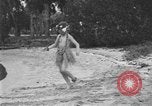 Image of Boy dressed in grass skirt performs hula dance Fort Lauderdale Florida USA, 1920, second 13 stock footage video 65675076871
